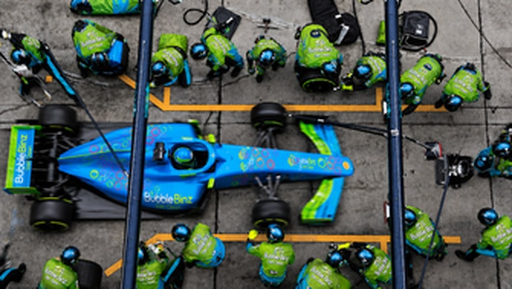 Pit crew servicing a race car
